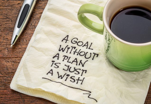a goal without a plan is just a wish - motivational handwriting on a napkin with a cup of coffee